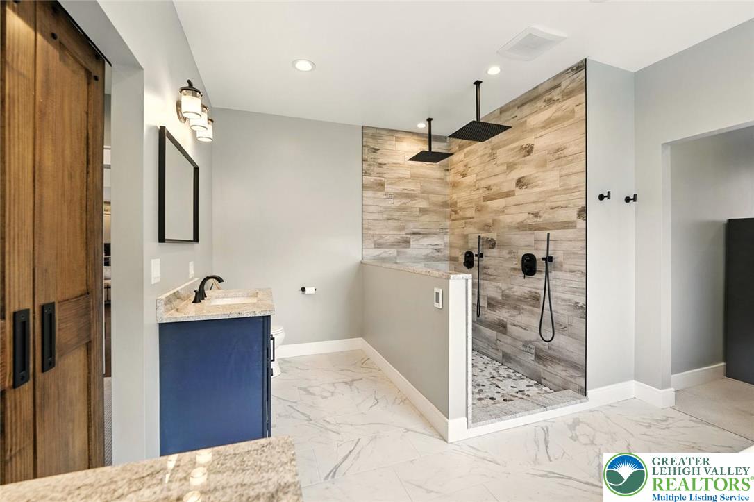 4733 Egypt Road Coplay, PA 18037 - Photo 8 of 40 a bathroom with a sink and mirror