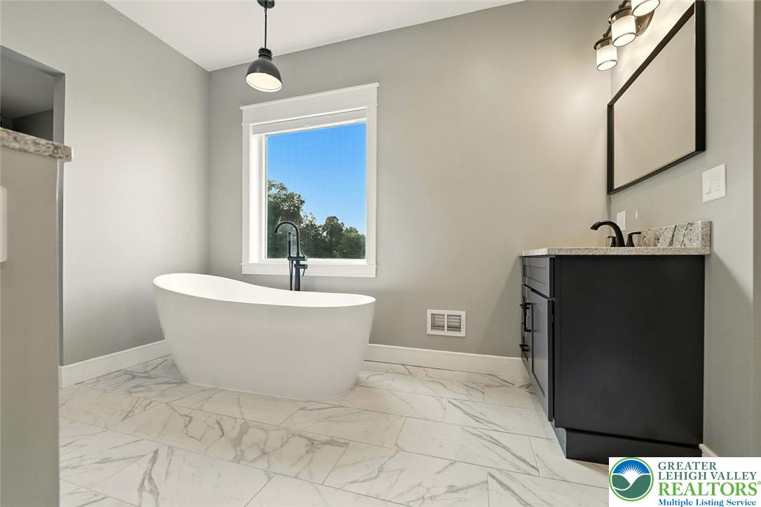4733 Egypt Road Coplay, PA 18037 - Photo 10 of 40 a white bath tub sitting in a bathroom