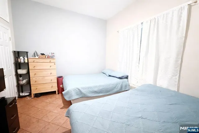 a bedroom with a bed and a closet