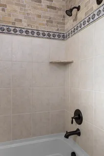a bedroom with a bed and a mirror