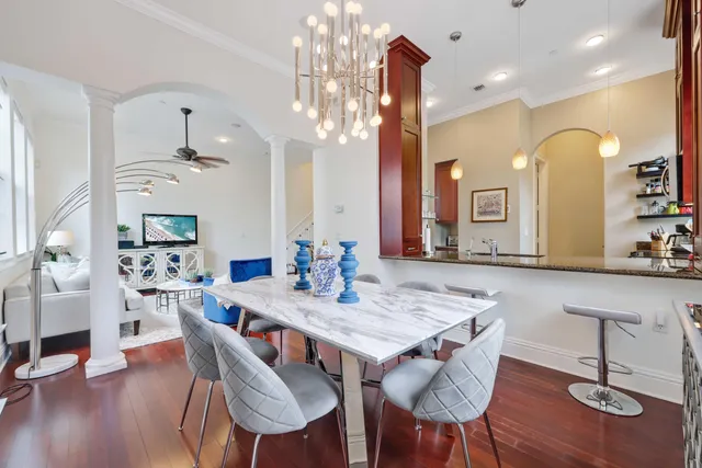 a view of a a dining room with furniture and wooden floor