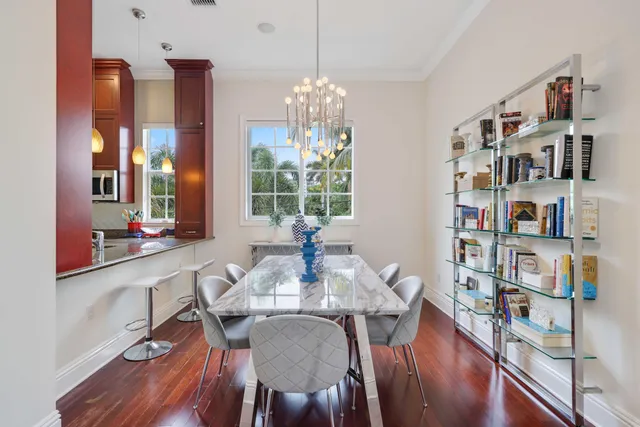 a view of a dining room with furniture and a book shelf