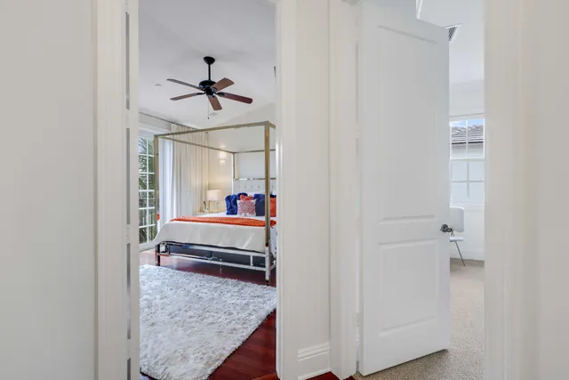 a bedroom with a bed and chandelier