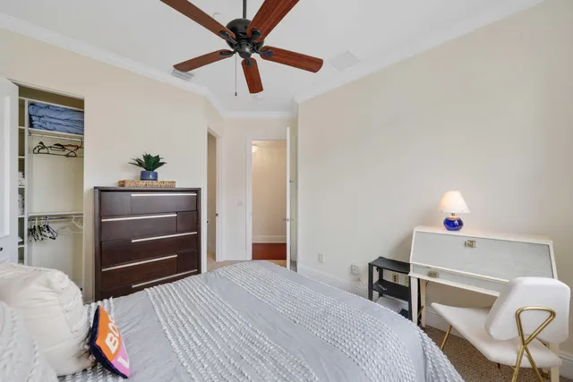 a bedroom with a bed and a dresser