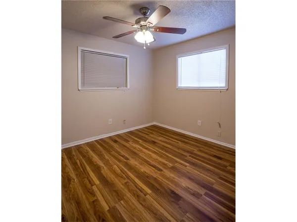 a view of a room with a ceiling fan