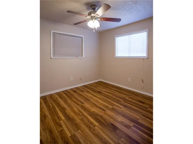 a view of a room with a ceiling fan