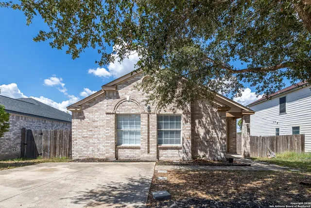 a view of a house with a tree