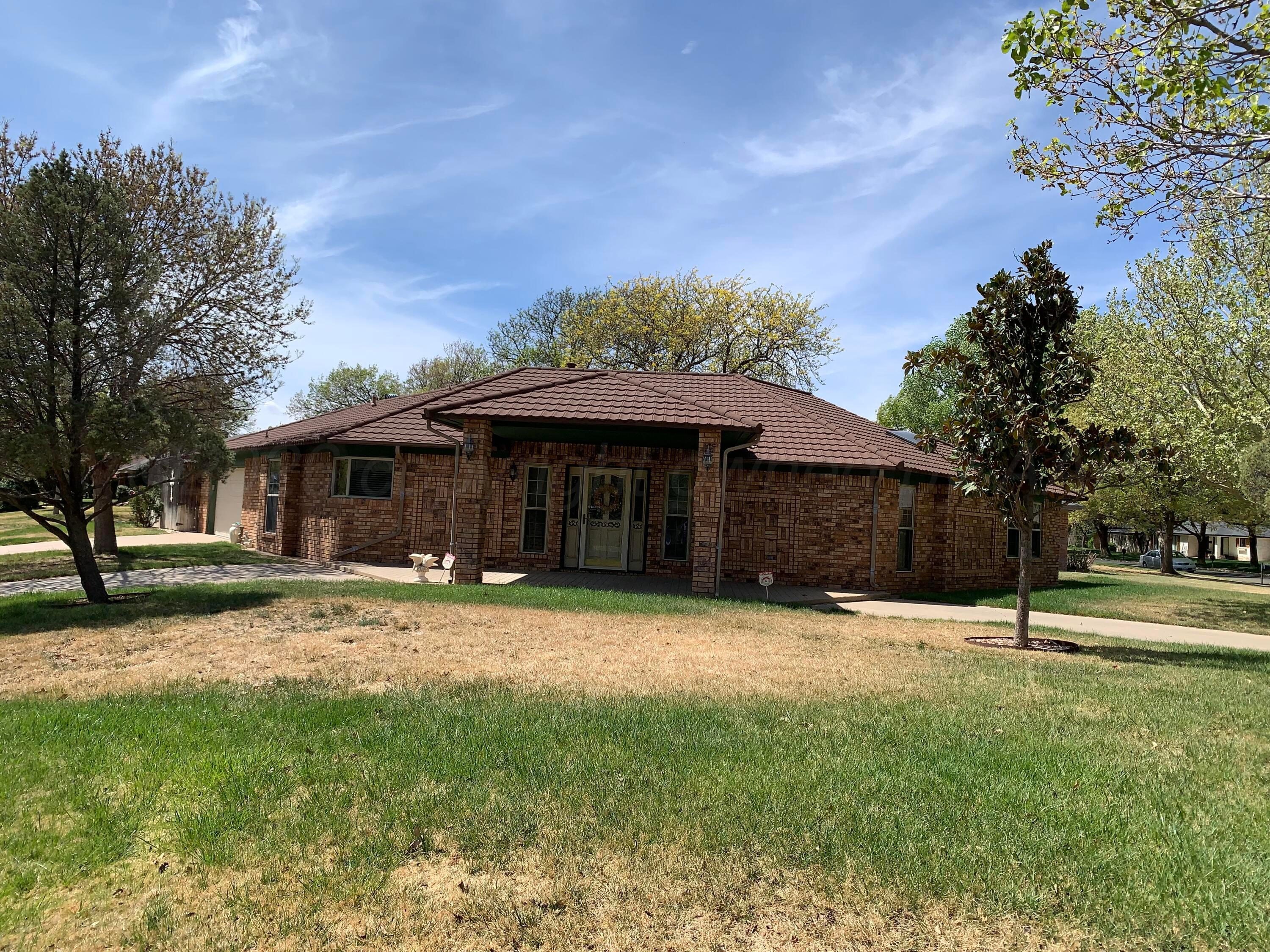6101 Ridgewood Drive Amarillo, TX 79109 - Photo 2 of 28 a backyard of a house with entertaining space