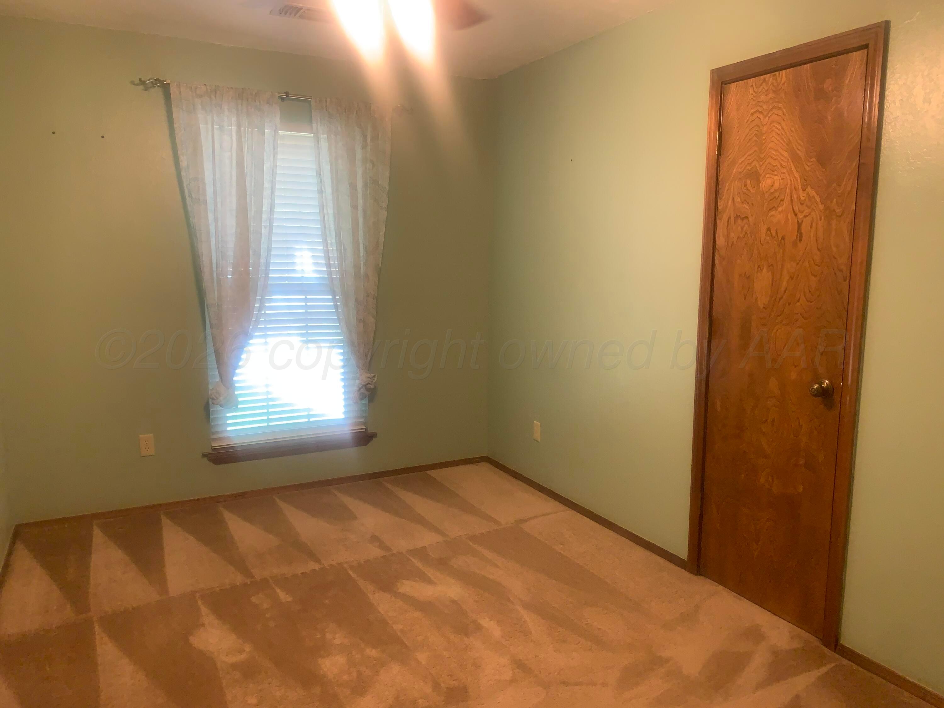 6101 Ridgewood Drive Amarillo, TX 79109 - Photo 22 of 28 an empty room with windows