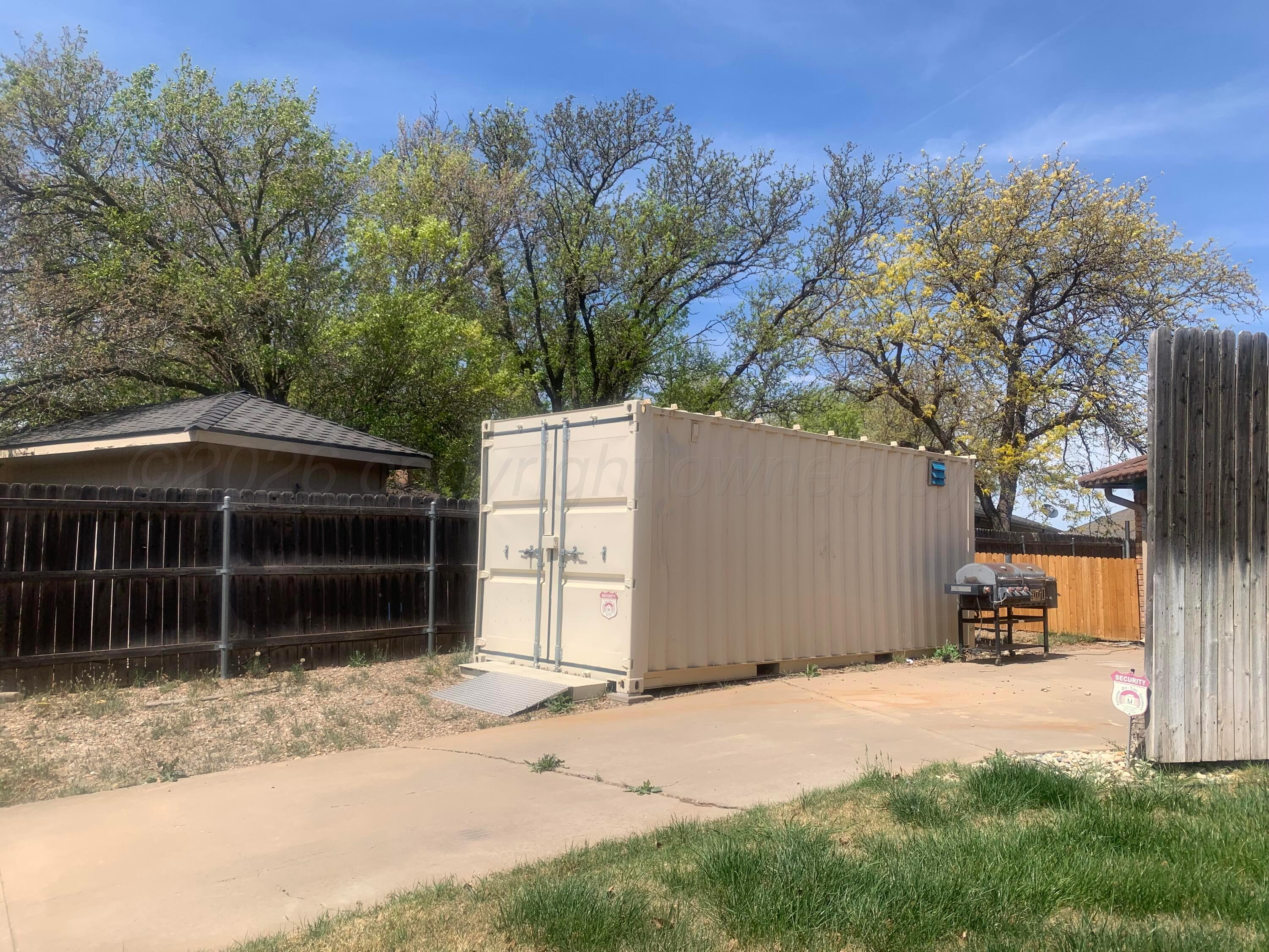 6101 Ridgewood Drive Amarillo, TX 79109 - Photo 27 of 28 a front view of a house with a yard and garage
