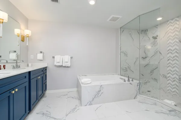 a bathroom with a bathtub and a toilet