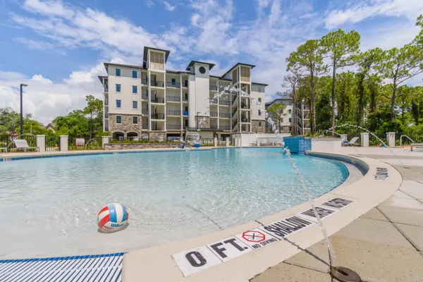 a view of building with outdoor space and swimming pool