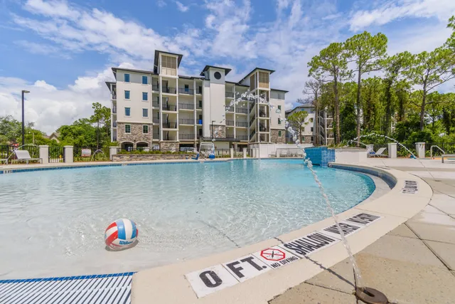 a view of building with outdoor space and swimming pool