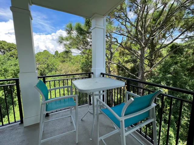 a view from deck with patio