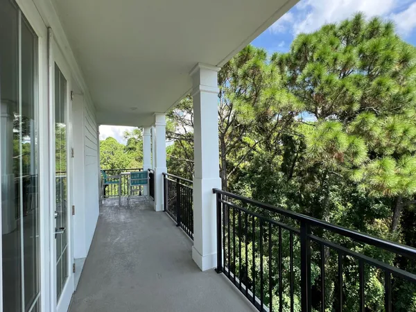 a view of a balcony with plants