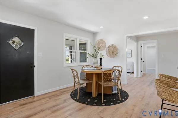 a dining room with furniture and window