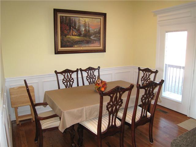 2001 Lasea Way Spring Hill, TN 37174 - Photo 4 of 20 Dining Room with Hardwood Floors and Wainscotting.
