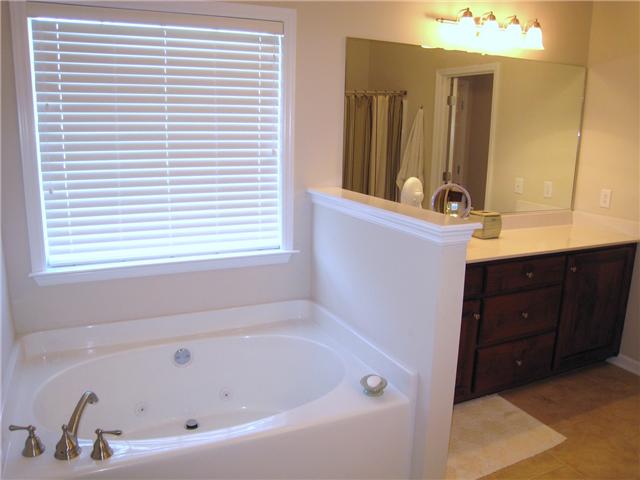 2001 Lasea Way Spring Hill, TN 37174 - Photo 10 of 20 Owner's Suite Bath with Tile floor and jetted tub.