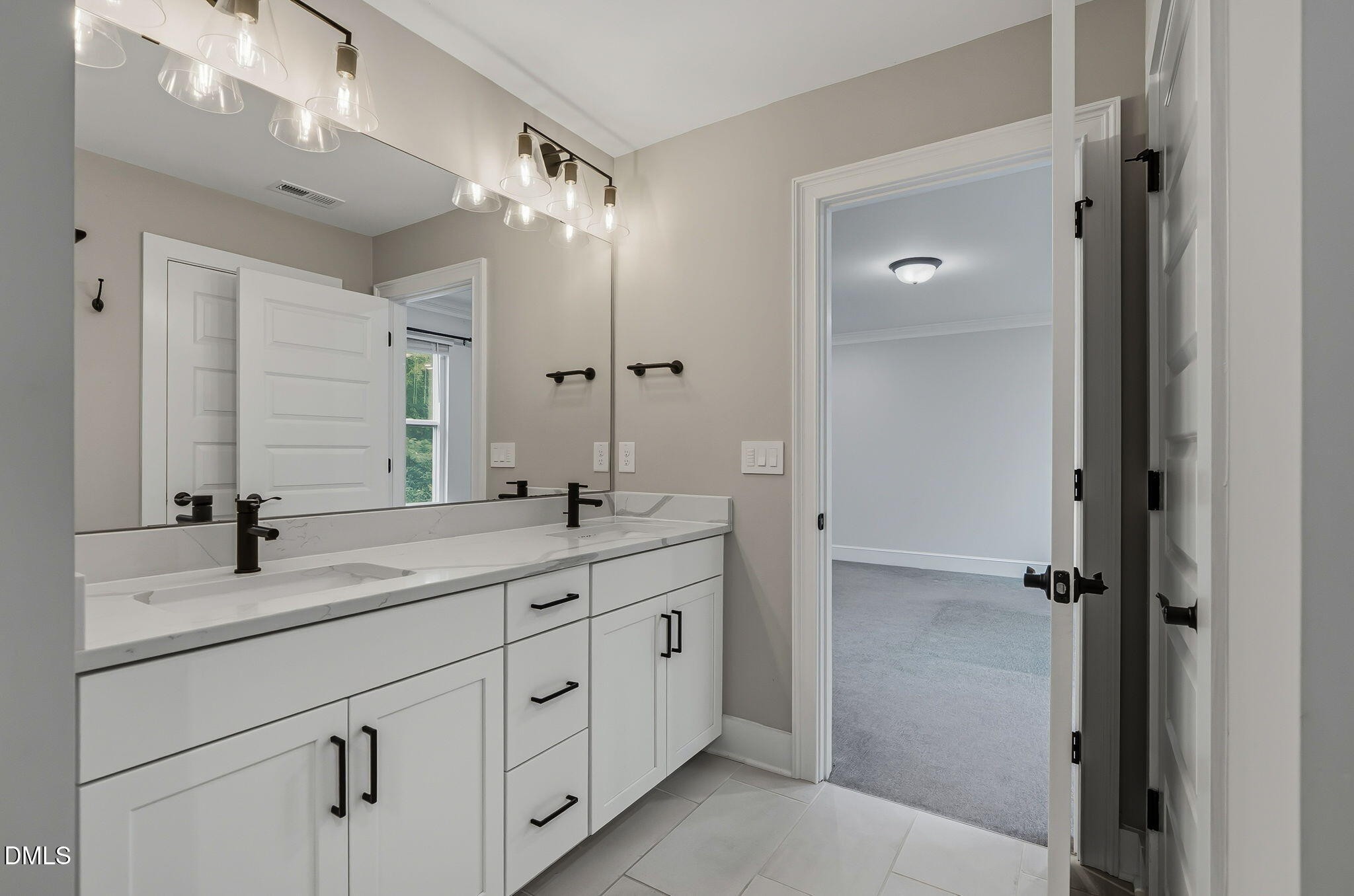 438 Diversity Way Raleigh, NC 27610 - Photo 27 of 33 a bathroom with a double vanity sink mirror and double