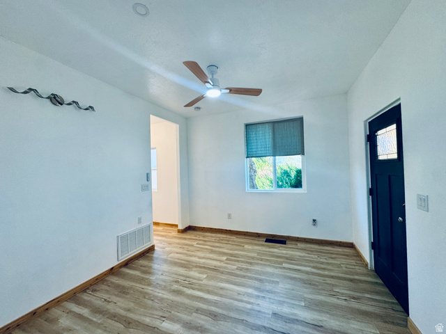 150 North 3050 East, Unit 4 St. George, UT 84790 - Photo 18 of 24 Bright room featuring wood-finish flooring and a contemporary ceiling fan