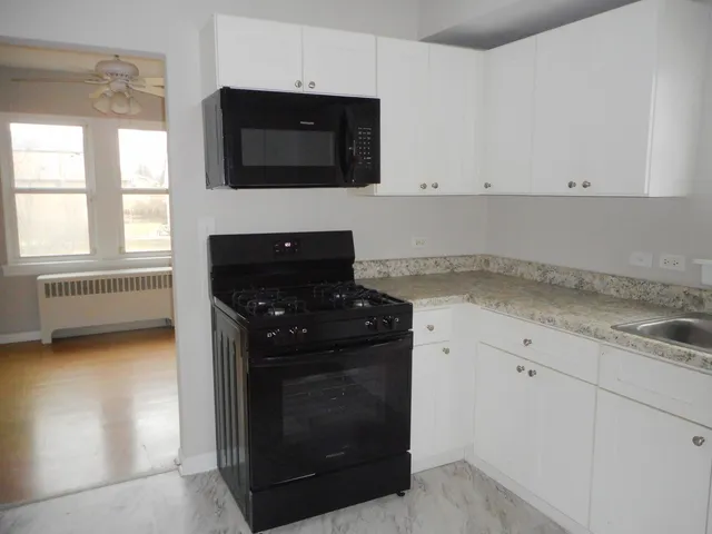 a kitchen with a stove and a microwave