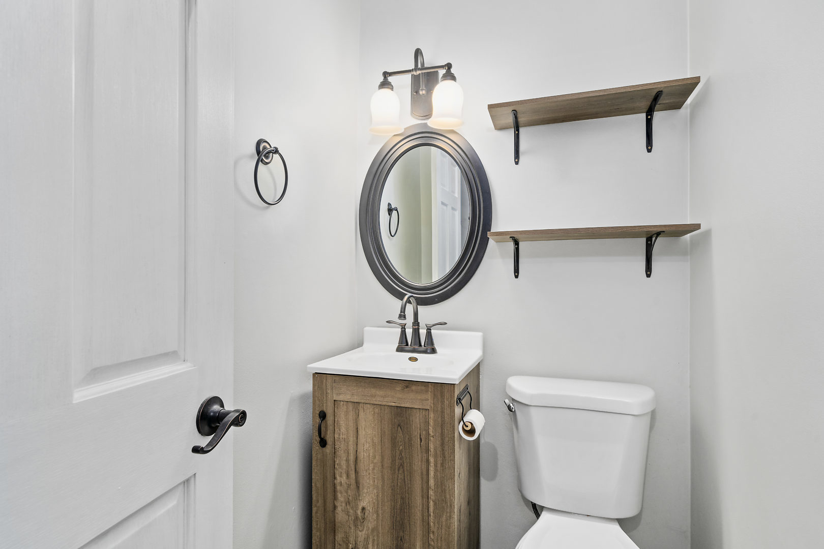 86 Bristol Ridge Road Bristol, IL 60512 - Photo 17 of 41 a bathroom with a toilet sink and mirror