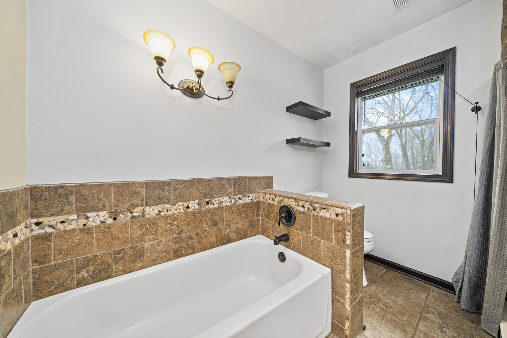 86 Bristol Ridge Road Bristol, IL 60512 - Photo 23 of 41 a bathroom with a bathtub and a window