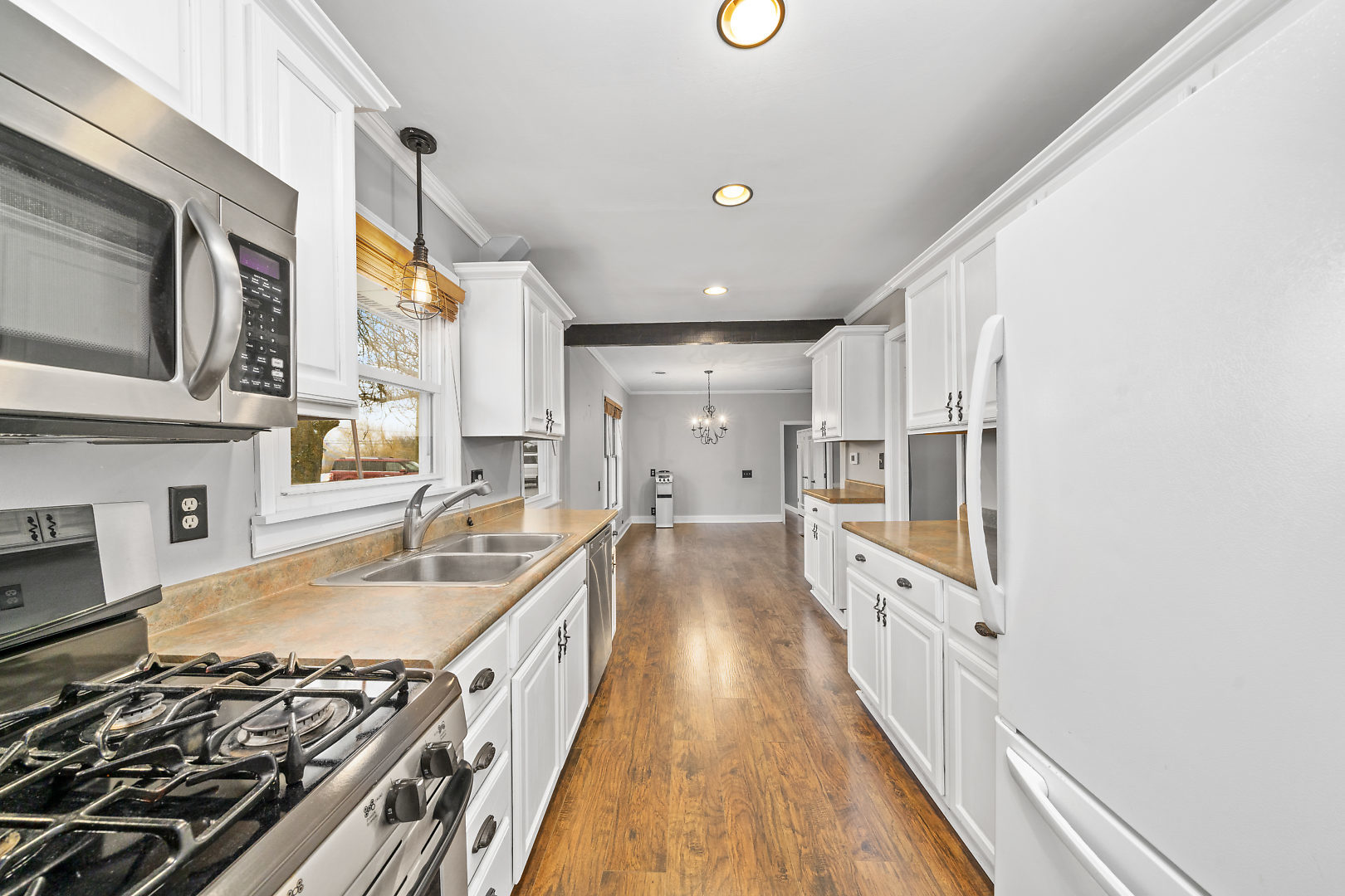 86 Bristol Ridge Road Bristol, IL 60512 - Photo 10 of 41 a large kitchen with stainless steel appliances granite countertop a lot of counter space and wooden floors