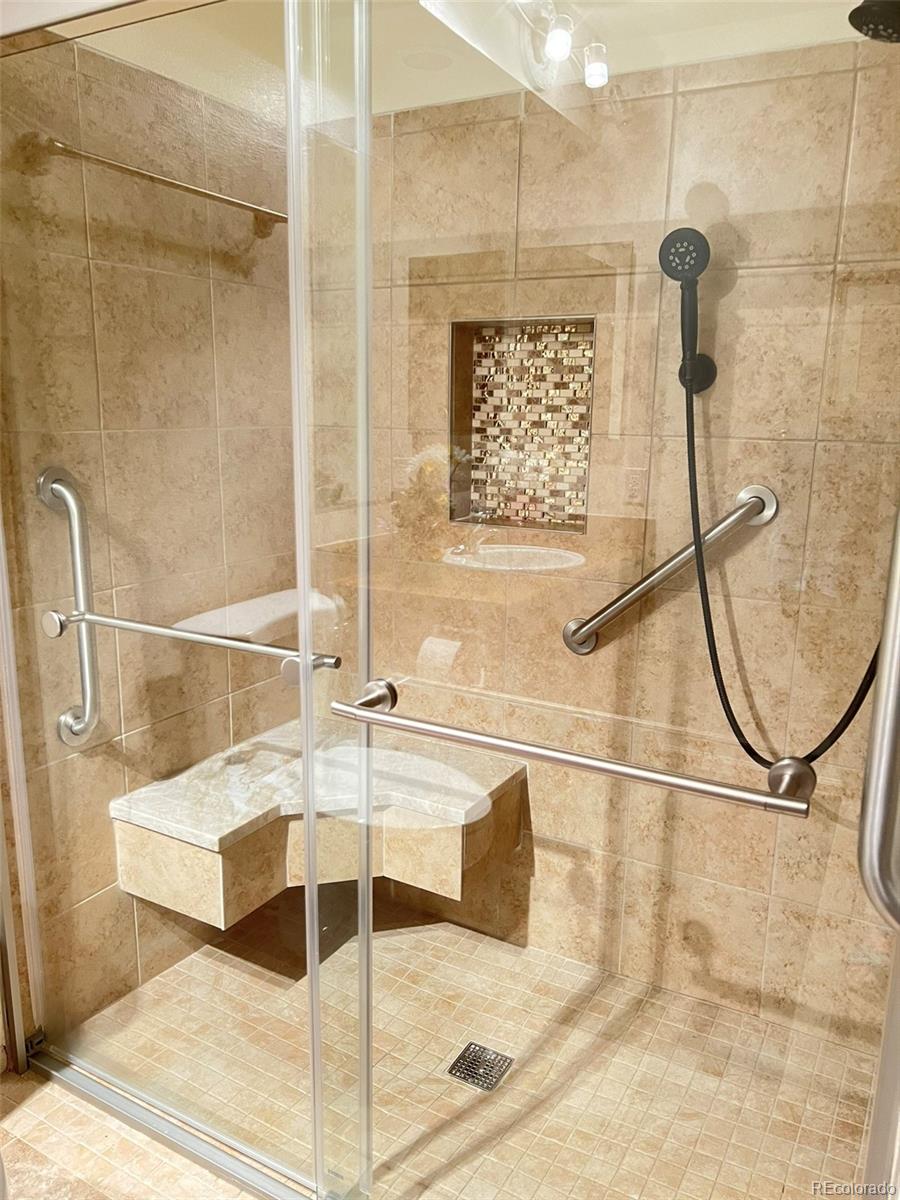 8488 Everett Way, Unit A Arvada, CO 80005 - Photo 17 of 27 a bathroom with a bathtub and a shower