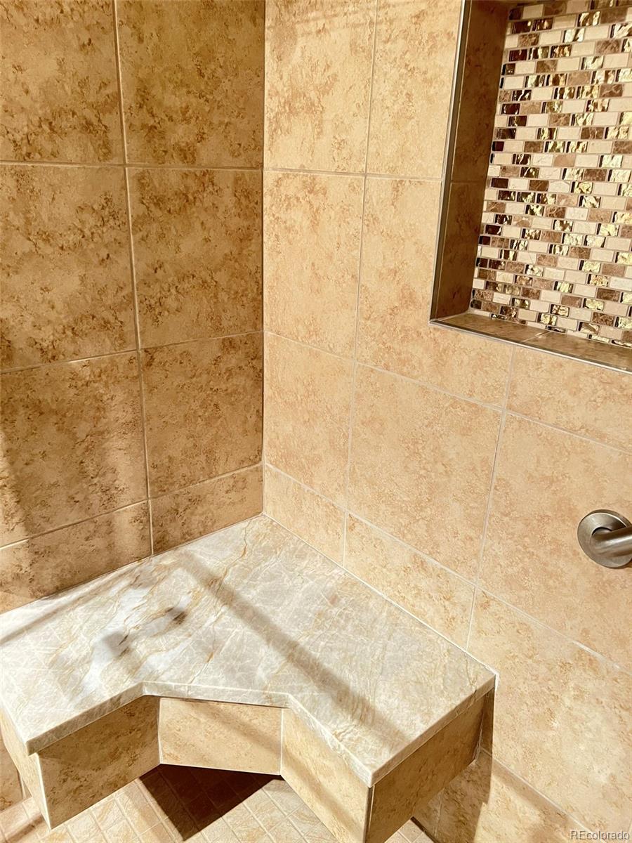 8488 Everett Way, Unit A Arvada, CO 80005 - Photo 18 of 27 a bathroom with a shower