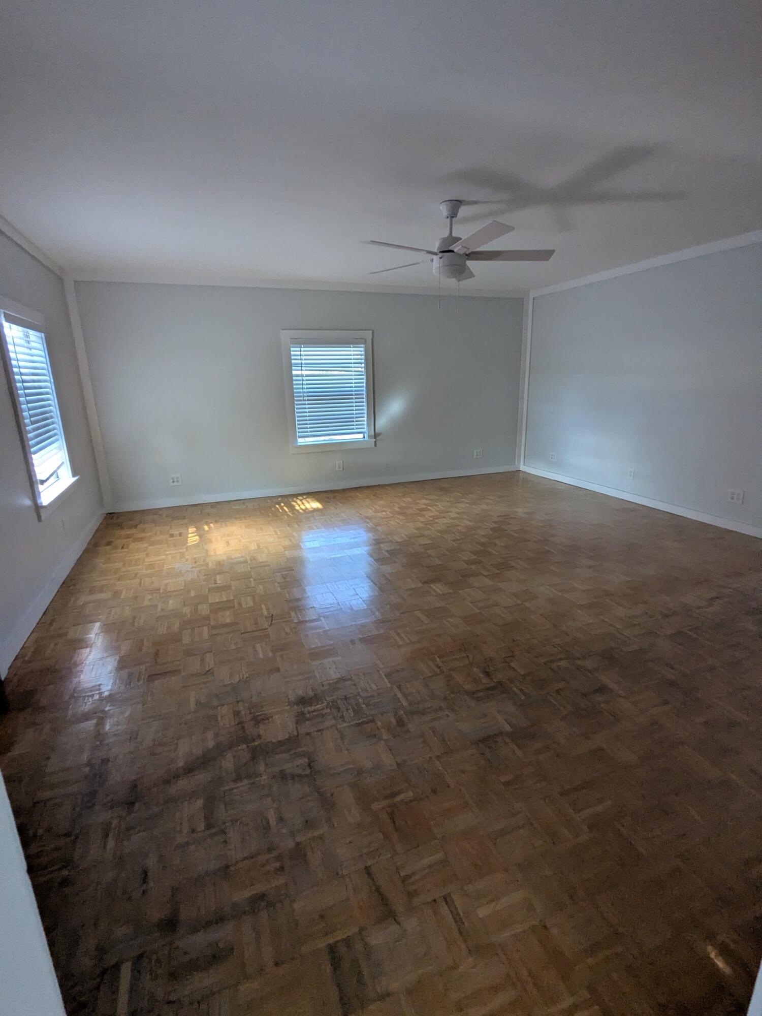 3611 Elizabeth Street Palm Springs, FL 33461 - Photo 11 of 19 en empty room with windows and ceiling fan