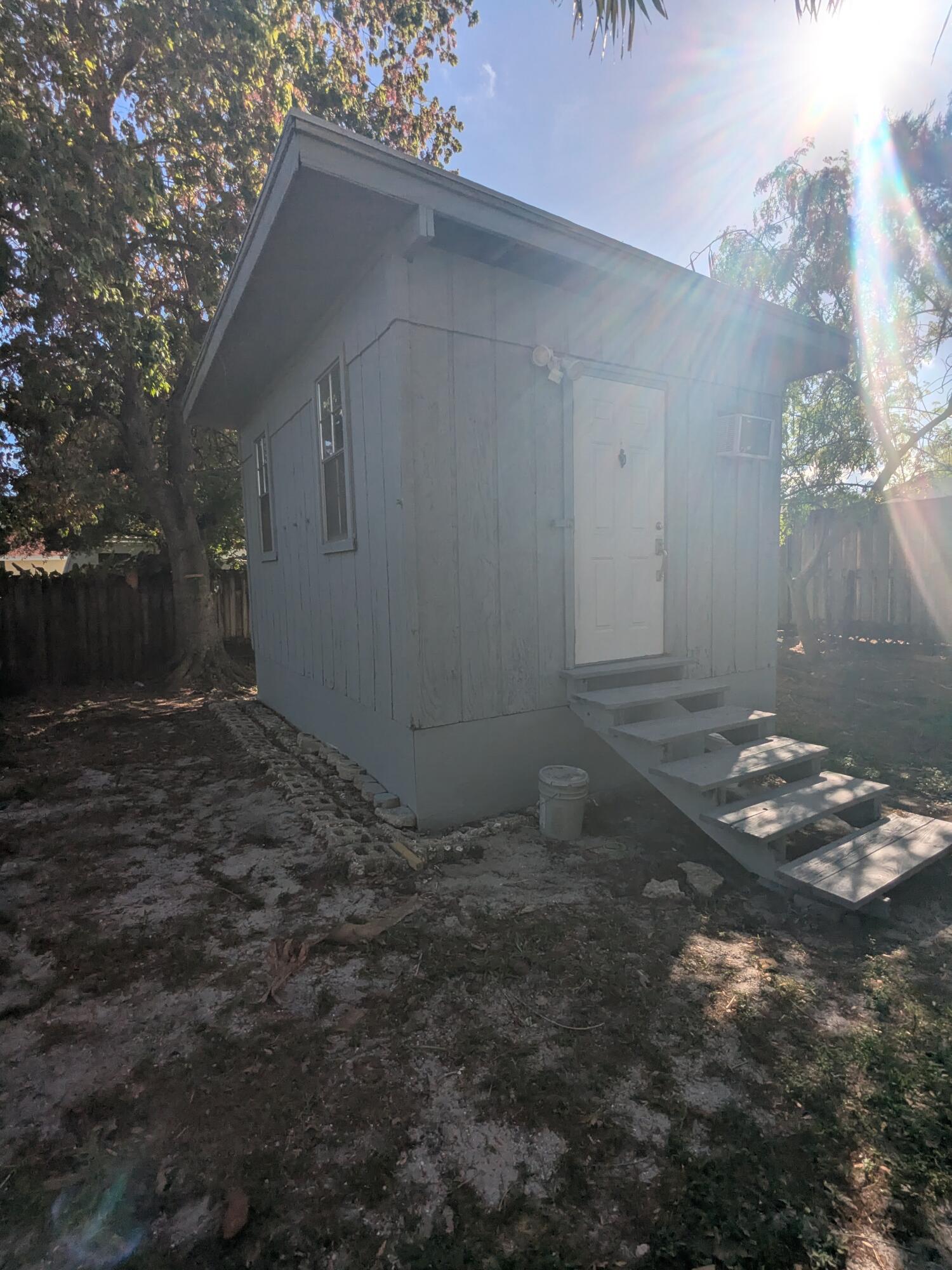 3611 Elizabeth Street Palm Springs, FL 33461 - Photo 16 of 19 a backyard of a house