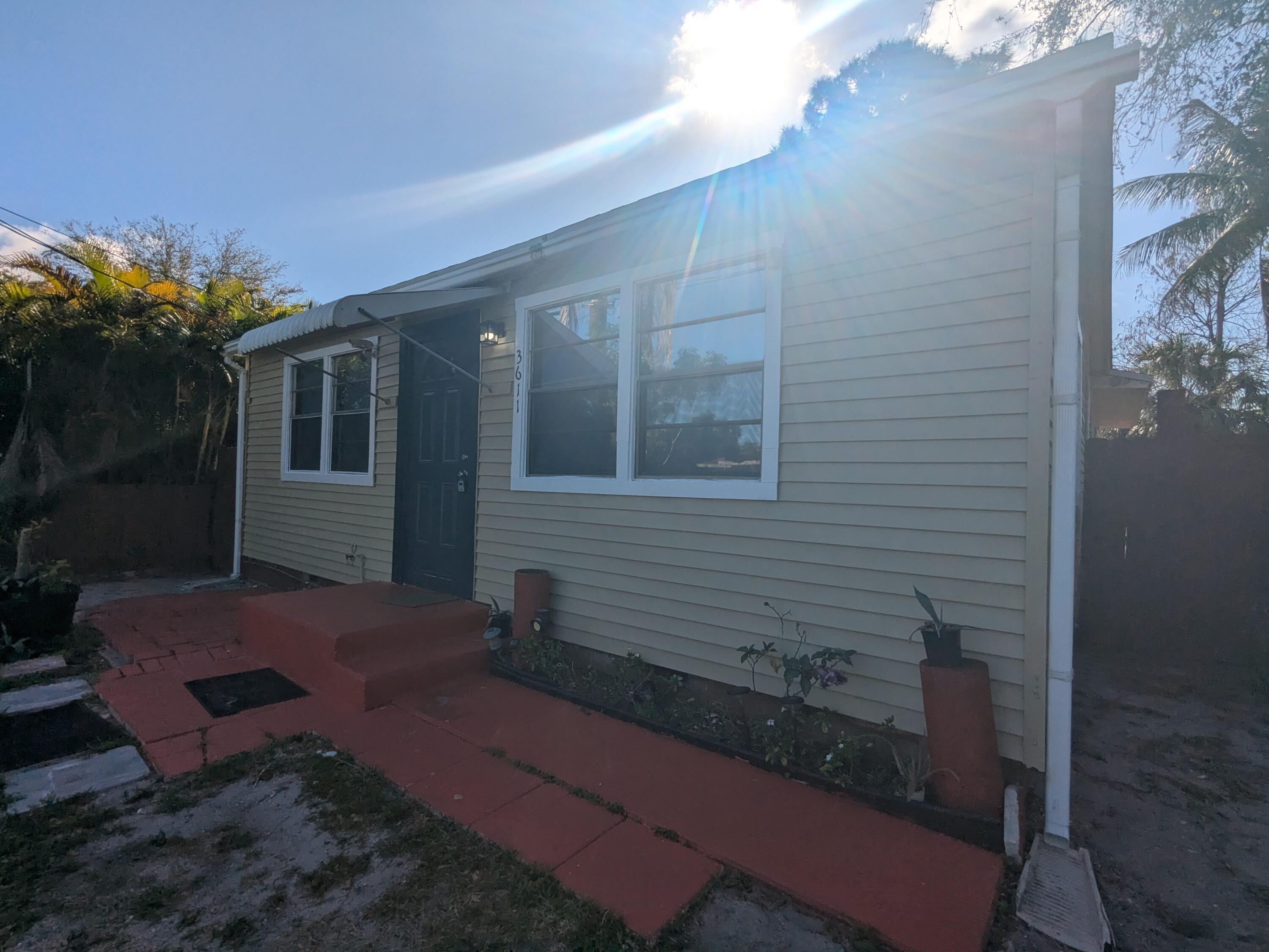 3611 Elizabeth Street Palm Springs, FL 33461 - Photo 3 of 19 a view of backyard with a patio