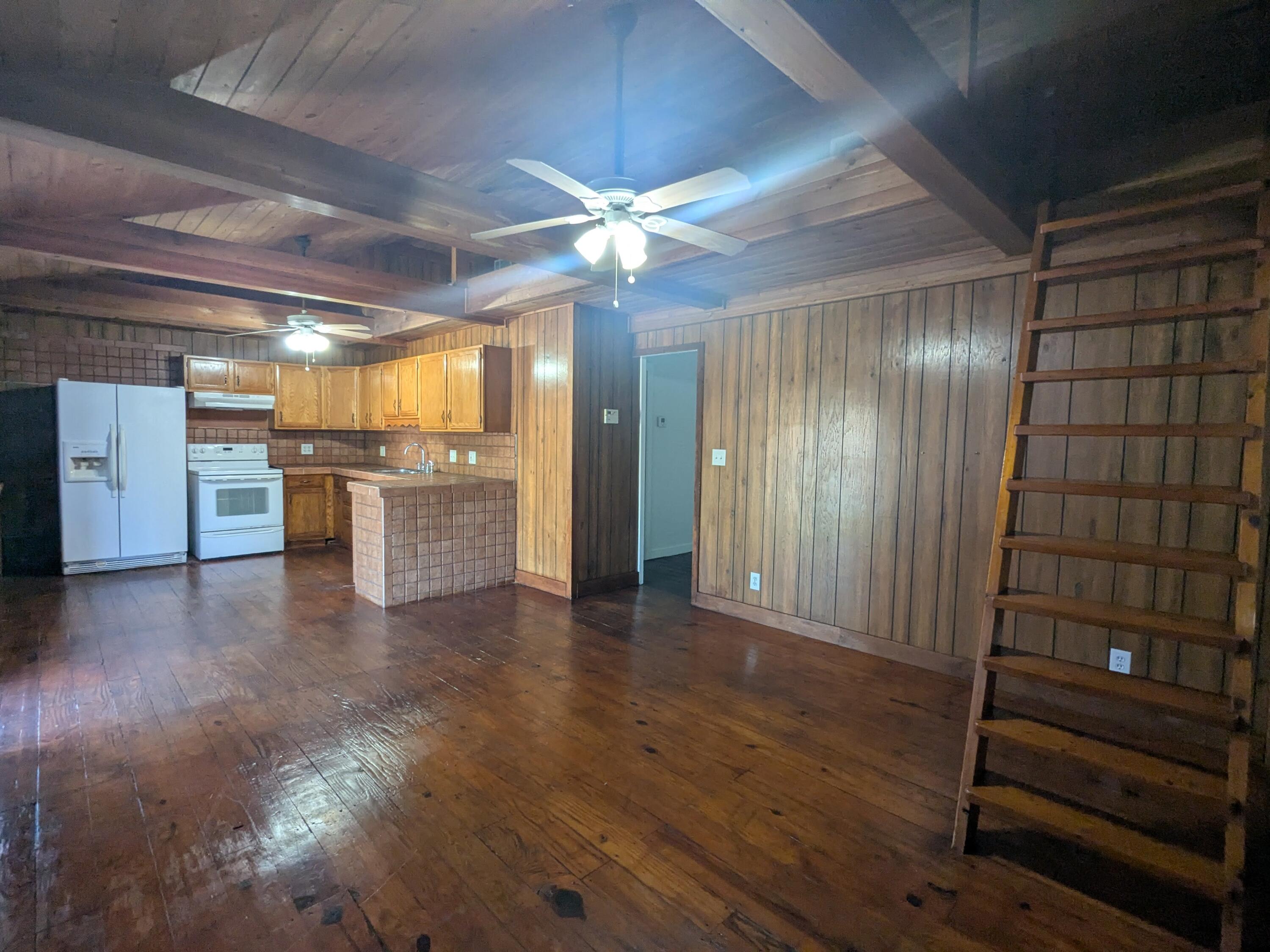 3611 Elizabeth Street Palm Springs, FL 33461 - Photo 5 of 19 a view of a hallway with a kitchen