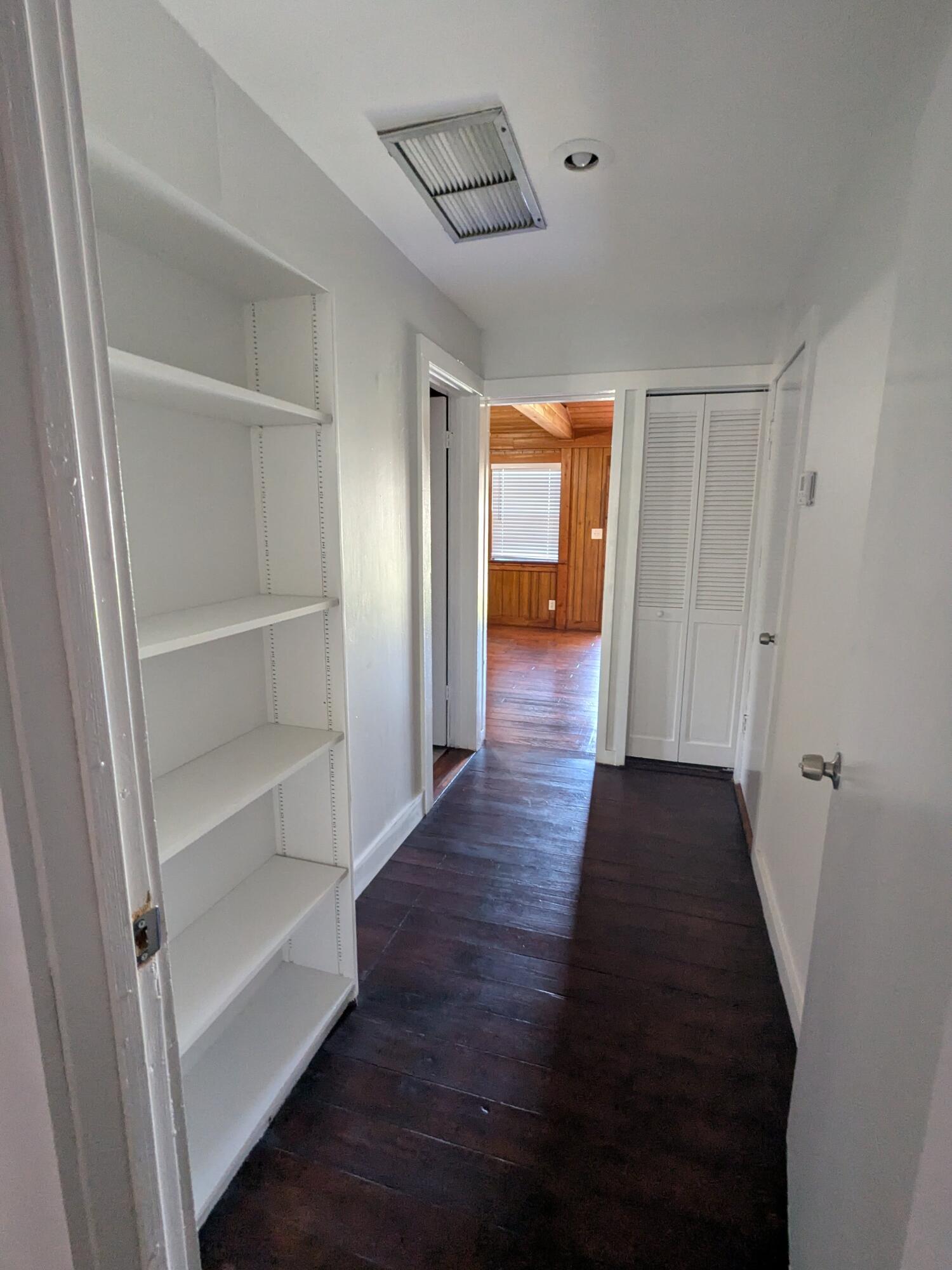 3611 Elizabeth Street Palm Springs, FL 33461 - Photo 10 of 19 a view of a hallway with wooden floor