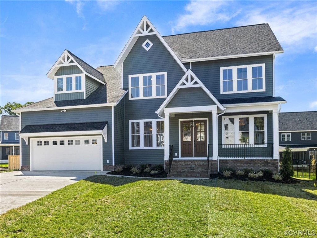 10708 River Fall Path Glen Allen, VA 23059 - Photo 1 of 35 a front view of a house with a yard and garage