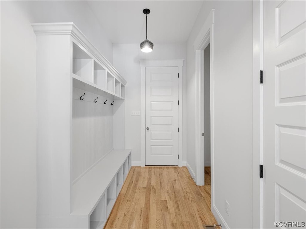 10708 River Fall Path Glen Allen, VA 23059 - Photo 23 of 35 a view of a hallway with wooden floor and staircase