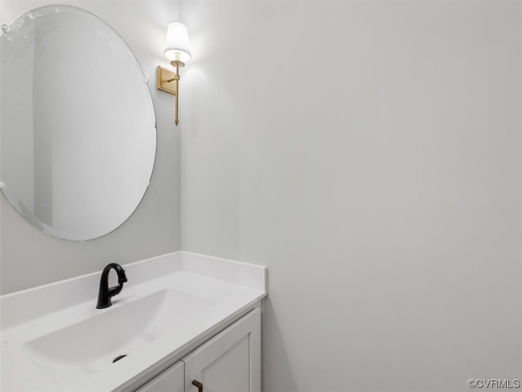 10708 River Fall Path Glen Allen, VA 23059 - Photo 24 of 35 a bathroom with a sink and a mirror