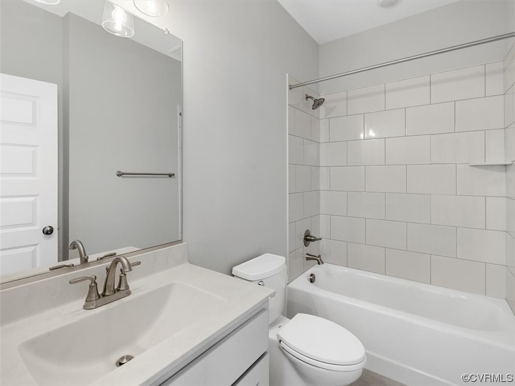 10708 River Fall Path Glen Allen, VA 23059 - Photo 26 of 35 a bathroom with a toilet a sink and a bathtub