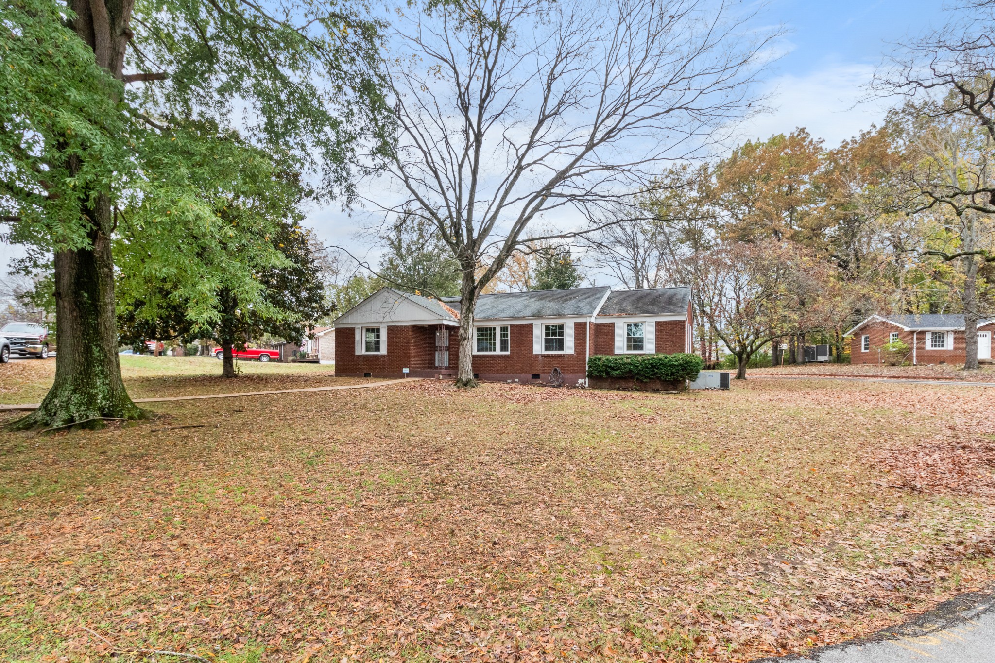 2007 Post Road Clarksville, TN 37043 - Photo 4 of 29 a front view of a house with a yard and trees