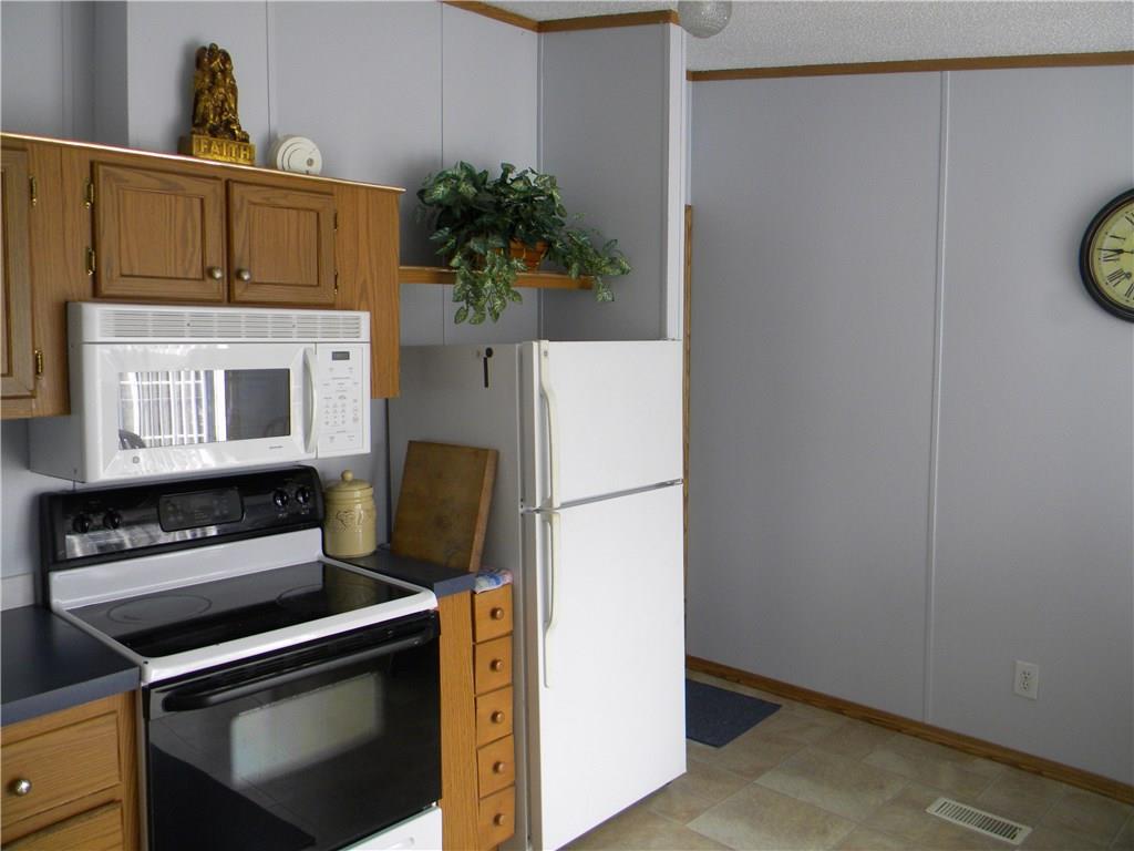 664 County Line Road Acme, PA 15610 - Photo 3 of 24 Just around the corner the laundry room awaits you.