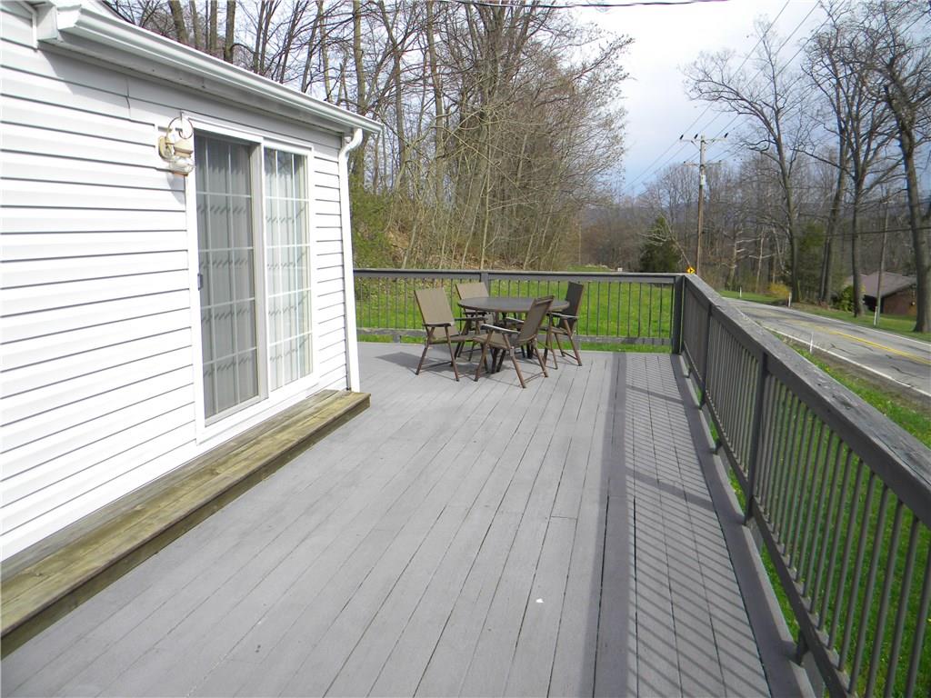 664 County Line Road Acme, PA 15610 - Photo 22 of 24 This wrap around deck has Mt Views for entertaining friends or family