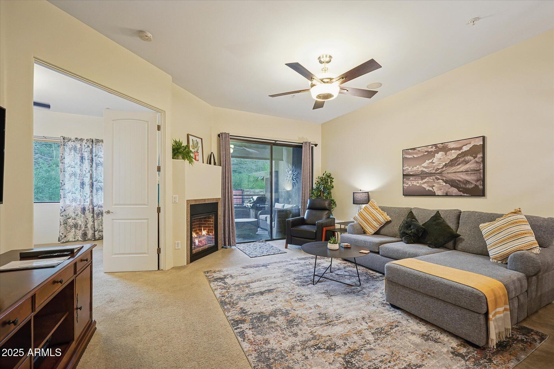 36600 North Cave Creek Road, Unit D6 Cave Creek, AZ 85331 - Photo 12 of 25 a living room with furniture and a fireplace