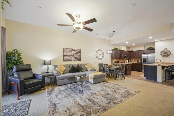 a living room with furniture and a large window