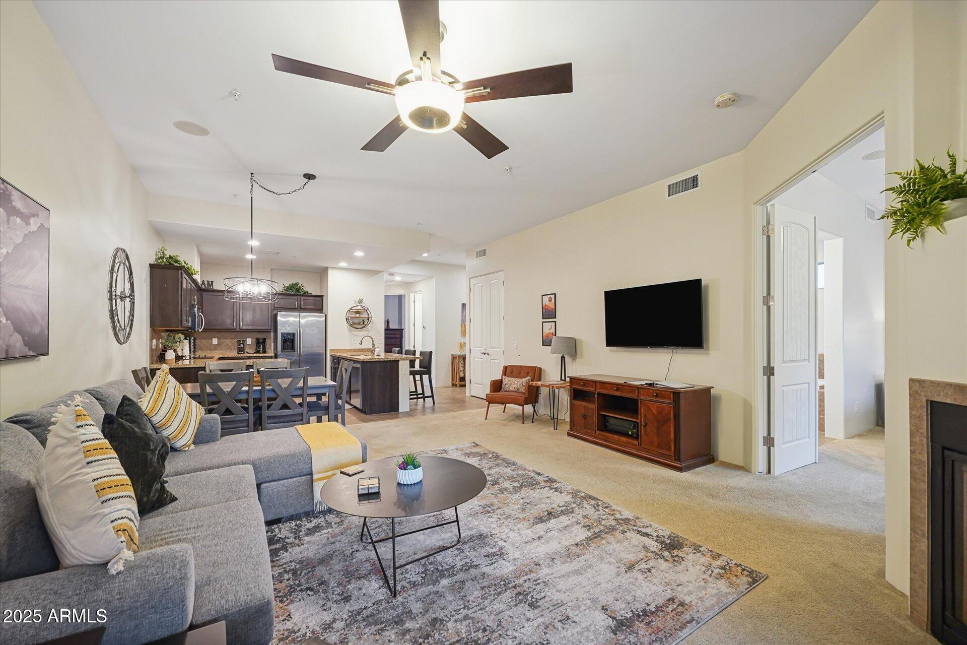 36600 North Cave Creek Road, Unit D6 Cave Creek, AZ 85331 - Photo 14 of 25 a living room with furniture and a flat screen tv