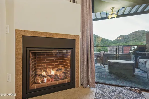 a living room with a couch and a fireplace