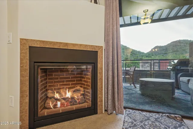 a living room with a couch and a fireplace