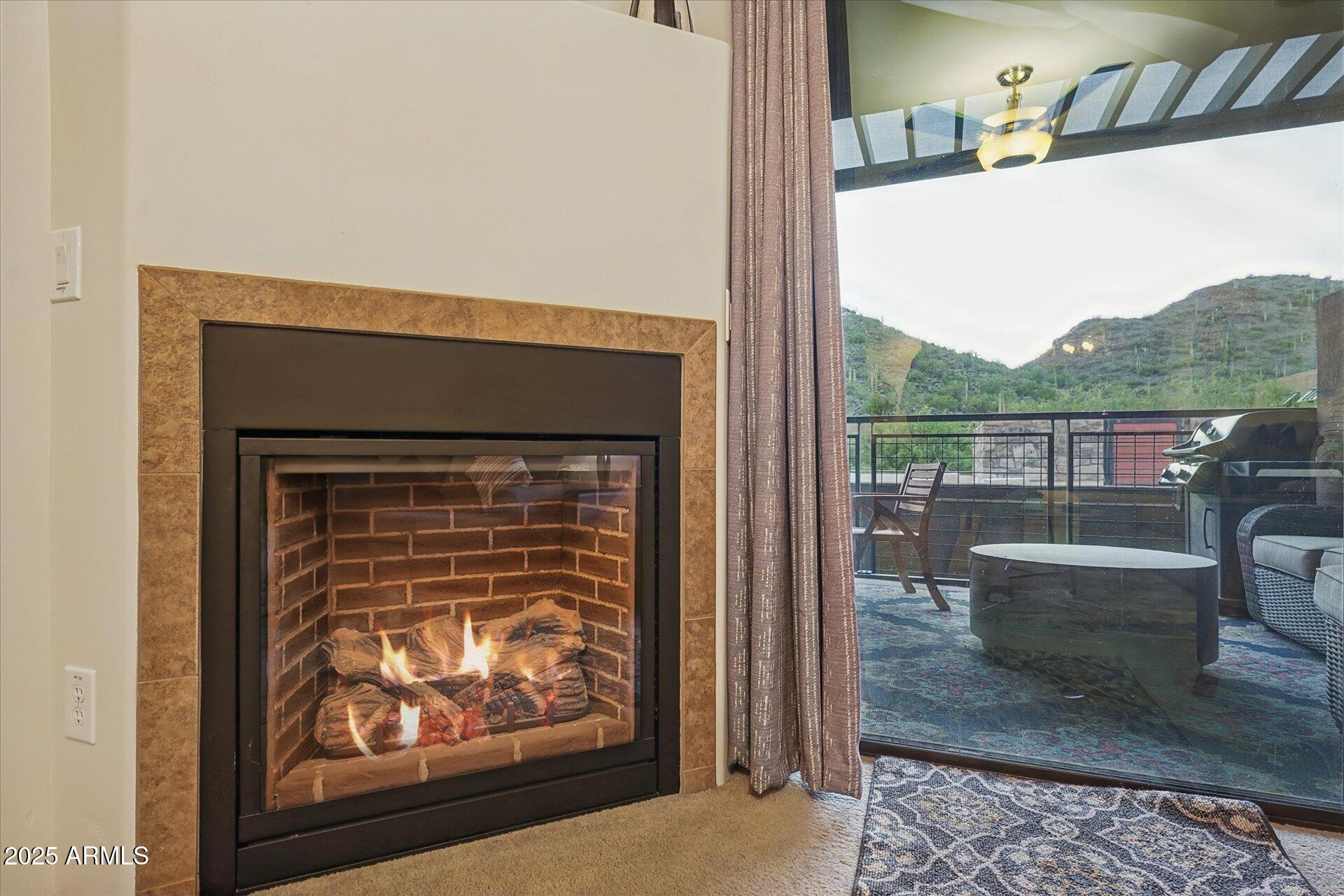 36600 North Cave Creek Road, Unit D6 Cave Creek, AZ 85331 - Photo 15 of 25 a living room with a couch and a fireplace