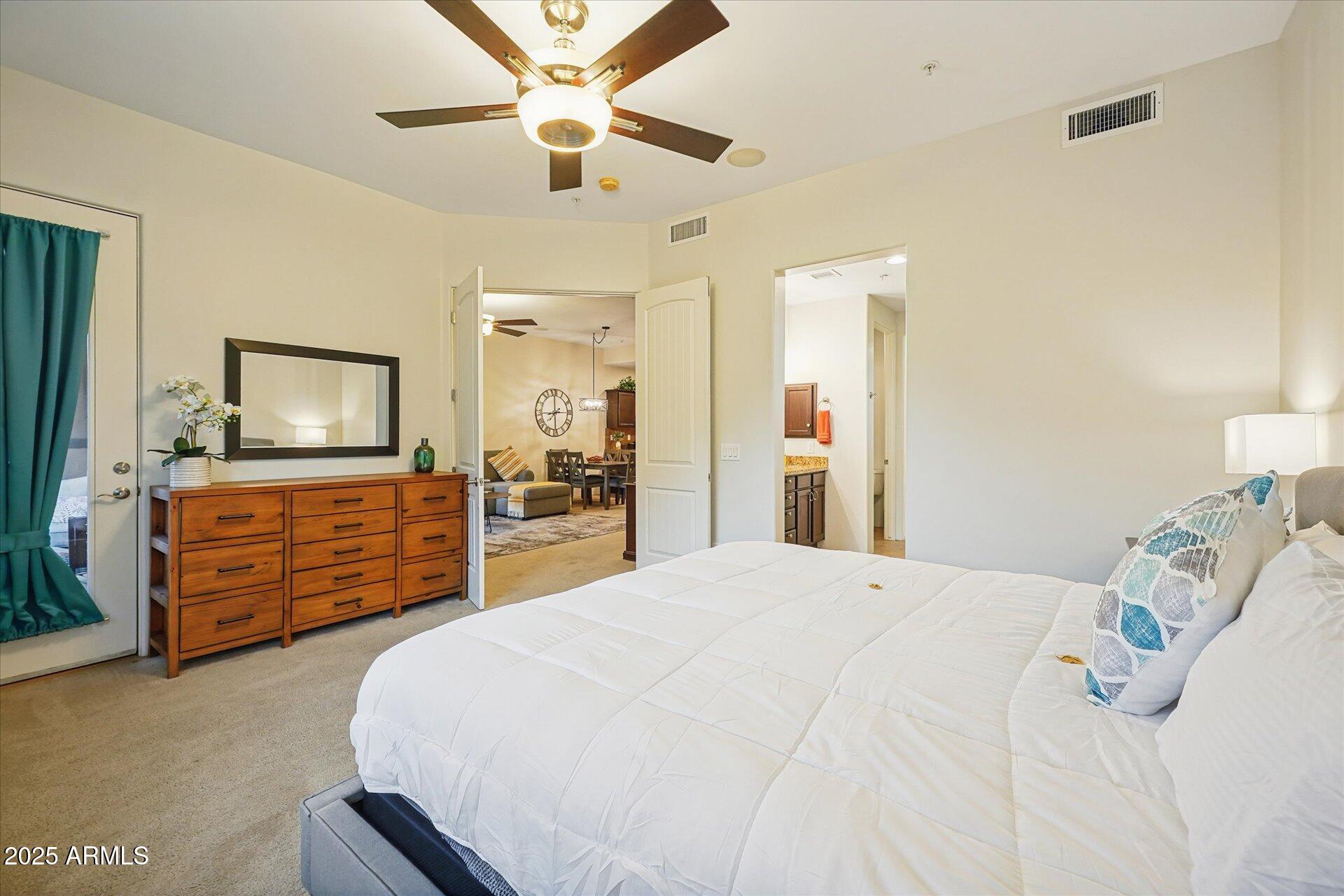 36600 North Cave Creek Road, Unit D6 Cave Creek, AZ 85331 - Photo 18 of 25 a bed room with a bed and a television