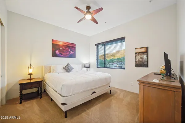 a bed room with a bed and a window